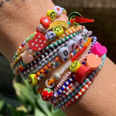 colored and white seed bead striped bracelets strung on elastic please gently roll on and off to prolong its life handmade in venice, ca Orange Kids, Orange Orange, Red Light, Green Light, Rainbow Stripes, Light Orange, Roll On, Purple Black, Orange Yellow