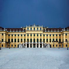 a large yellow building with lots of windows