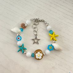 From our Coconut-Girl Collection🌺🥥 let your summer style sizzle with the Piedra Acuática Bracelet! This sweet little accessory blends clay beads, glass seed beads, stone beads and cat eye stone beads for a truly tropical look. Features a stainless steel lobster clasp, you can rock this coconut girl approved bracelet all summer long! 🌊🐚 Blue Bracelets With Lobster Clasp For Beach, Ocean-inspired Colorful Beaded Summer Jewelry, White Starfish Charm Bracelet For Beach Season, Adjustable Colorful Beads Charm Bracelet For Beach, Playful Adjustable Friendship Bracelets For Beach, Multicolor Starfish Charm Jewelry For Vacation, Multicolor Charm Bracelet For Beach, Vacation Bracelet With Lobster Clasp, Trendy Handmade Jewelry For Beach Party