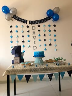 a birthday party with blue and silver decorations