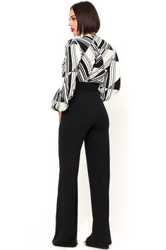 The Black and White Jumpsuit by Bella Chic is the total package, elegant, classic, and stunning! You’ll look completely irresistible in this one piece outfit. Go from career to cocktails in this long sleeve jumpsuit! This black and white jumpsuit starts with a v neck design and a fitted waist top that flows into relaxed wide leg pants, while a waist cinching belt completes this look! This jumpsuit is made of a stretch knit fabric that shapes and hugs your curves. The black and white jumpsuit is Elegant Long Sleeve Jumpsuits And Rompers For Evening, Elegant Long Sleeve Pantsuit For Night Out, Sleek Long Sleeve Formal Pantsuit, Chic Long Sleeve Pantsuit For Party, Chic Long Sleeve Pantsuit, High Waist Bodysuit For Work, Chic Long Sleeve Bodysuit For Night Out, Chic Long Sleeve Pantsuit For Work, Sleek Black Long Sleeve Jumpsuits And Rompers