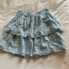 Nwot!! Super Cute Blue Floral Skirt For So Many Occasions!’ Light Blue Lined Tiered Skirt, Spring Light Blue Tiered Skirt, Blue Summer Skirt With Elastic Waistband, High Waist Blue Ruffled Skort, Blue Tiered Skirt For Day Out, Blue Mini Skirt Bottoms For Summer, Blue Ruffled Mini Skirt, Light Blue Ruffled Mini Skirt, Blue Short Summer Skirt