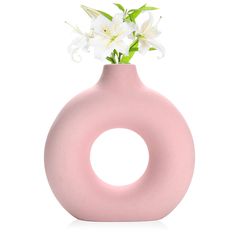 PRICES MAY VARY. Product advantages: The light pink with the donut shape makes it easier for you to like this vase. pure ceramic production. Anti-breakage packaging. Modern minimalist design style, go great to anywhere. Decorative Matching: This donut vase is perfect for fresh flowers, dried flowers, buds, artificial flowers and plants decoraitons, or with pampas grass and other decorative plants Decor options: circle vase for entryway, living room table decor, mantle, farmhouse, shelf decor, co Shelf Decor Corner, Clay Flower Vase, Corner Table Decor, Mantle Farmhouse, Decor Living Room Table, Farmhouse Shelf Decor, Circle Vase, Living Room Table Decor, Boho Table Decor