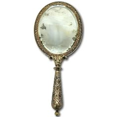 an antique looking mirror on a white background