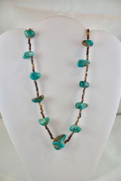 Vintage c1940's-1950's Navajo Heishi necklace Turquoise and Oyster Shell beads The turquoise appears to be natural and not color enhanced graduated stones 3/8" to 1 inch in size  measures 30 inches long strung on a cotton thread  very good condition Southwestern Turquoise Gemstone Necklace For Healing, Southwestern Brown Turquoise Necklace With Natural Stones, Collectible Turquoise Necklace With Natural Stones, Spiritual Turquoise Necklace Collectible, Collectible Turquoise Necklaces With Natural Stones, Vintage Turquoise Single Strand Necklace, Unique Southwestern Green Necklace, Turquoise Natural Stones Necklace For Collectors, One Of A Kind Southwestern Green Necklace