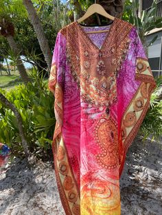 Bohemian Multicolor Print V-neck Kaftan, Bohemian V-neck Boho Dress For Vacation, Bohemian Multicolor Tunic Cover-up, Flowy Printed Boho Tunic Dress, Bohemian V-neck Kaftan For Vacation, Bohemian V-neck Printed Kaftan, Bohemian Flowy Loose Maxi Dress, Bohemian V-neck Maxi Dress For Resort, Multicolor V-neck Maxi Dress For Beach