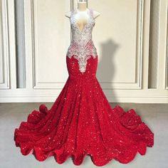 Unveil your inner goddess with our exquisite Red Sequin Mermaid Gown. This stunning masterpiece is meticulously adorned with shimmering sequins that catch the light with every movement, creating a dazzling effect that ensures you won't go unnoticed. The deep V-neckline and intricate beaded detailing at the bodice add a touch of elegance and sophistication, making it the perfect choice for any grand event or special occasion.The mermaid silhouette hugs your curves in all the right places, flaring Glamorous Red Carpet Mermaid Dress, Glamorous Floor-length Mermaid Dress For Red Carpet, Glamorous Mermaid Dress For Prom And Red Carpet, Glamorous Mermaid Dress For Red Carpet And Prom, Floor-length Sequin Mermaid Dress For Pageant, Floor-length Sequined Mermaid Dress For Pageants, Glamorous Red Mermaid Dress For Red Carpet, Glamorous Sequined Gown For Red Carpet, Red Carpet Mermaid Dress With Sweep Train For Prom