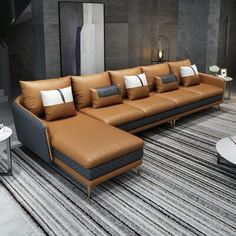 a large sectional couch sitting on top of a carpeted floor next to a table