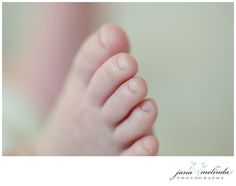 a baby's foot is shown in this close up photo