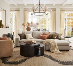 a living room filled with furniture and a fire place