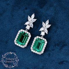 "❤Jewelry Details -Gold Type : Solid 10K Gold / Solid 14K Gold / Solid 18K Gold / Platinum (Choose One in Material Option) -Center Stone: Lab Created Emerald 7*9mm, Approximately 3.0ct*2pcs Color: Green--- 5A Clarity: VVS Cut: Emerald Cut / 3EX -Side Stone: Moissanite Moissanite Total Carat Weight: approx. 1.22ctw (a pair) Cut: Marquise Cut, Round Cut Color: D-F Clarity: VVS1 Earring Length: 25*9.5mm SKU: YE0047 ~*-*~Purchase Guarantee: - All our jewelry is handmade, and each process is refined. - 14 Day Refund Guarantee. - All our products are Free Shipping. - Free Gift Box&Packing. ~*-*~Please contact us if you need service: 1. Ring Resizing. 2. Metal Change(PT950/10k/14k/18k White/Yellow/Rose Gold). 3. Engraving ring (less than 10 letter). 4. Accept customization. We believe that our qu Emerald Earrings With Brilliant Cut For Wedding, May Birthstone Diamond Earrings For Wedding, Emerald Earrings With Brilliant Cut For Anniversary, Luxury Green Diamond Earrings For Wedding, Dangle Diamond Earrings With 17 Jewels For Wedding, Diamond Earrings For Wedding, May Birthstone, Sterling Silver Baguette Cut Diamond Earrings For Wedding, Formal Brilliant Cut May Birthstone Earrings, Diamond White Bridal Earrings With Gemstones