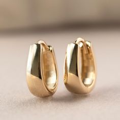 Add a little more style with these soft edged teardrop huggies. 14K Gold Hypoallergenic, lead and nickel free Width 4mm Inside Diameter 9mm Hinge opening, Click to close #ES190-9G Gold Plated Teardrop Huggie Earrings, Elegant Gold Teardrop Huggie Earrings, Classic Gold-tone Huggie Jewelry, Gold-tone Huggie Earrings, Gold-tone Metal Huggie Jewelry, Knots Jewelry, Jewelry Gift Guide, Choker Pendant, Moms Bracelet