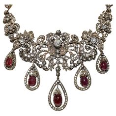 In very good condition. Total weight is 102.4 grams. Totally is diamond about 20 ct. Totally is ruby 28 ct. Total lenght is chain 32 cm. Acid tested to be 8k real gold. Please contact for any questions. Luxury Traditional Rose Cut Diamond Necklace, Antique Rose Cut Diamond Necklaces For Evening, Antique Evening Necklace With Rose Cut Diamonds, Vintage Ruby Necklace For Formal Occasions, Ornate Rose Cut Diamond Necklace For Formal Occasions, Victorian Ruby Necklace For Formal Occasions, Victorian Jeweled Necklaces For Formal Occasions, Antique Diamond Evening Necklaces, Antique Diamond Necklace For Evening