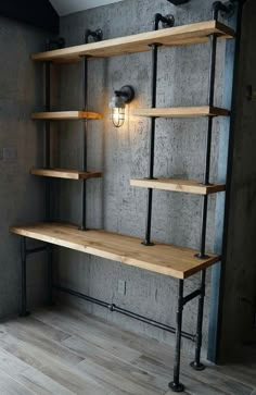 an industrial shelving unit in the corner of a room with wooden shelves and metal pipes