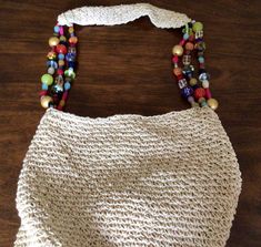 Beautiful Cappelli large beaded shoulder bag.  This bag reminds on summer and beach. This bag is beautiful made with colorful beads and shoulder straps. It looks new, it doesn't show any ware. It has one zipped compartment and 2 smaller compartments. The measurements are: the height is 14 inches, the width is 14 inches. The strap is 15 inches. I have a few other Cappelli Purses in my Store https://globalvintagenesting.etsy.com/listing/1567788430 https://globalvintagenesting.etsy.com/listing/1586137485 https://globalvintagenesting.etsy.com/listing/1686355968 Beaded Shoulder Bag, Bag Summer, Beaded Bag, Bag Shoulder, Beach Bag, Purses And Handbags, Shoulder Straps, Straw Bag, Shoulder Bags