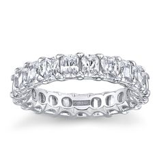 a white gold band with assorted cut stones on the inside and outside, set in 18k white gold