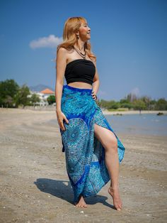 Step into the spirit of boho chic with our Purple Peacock Wrap Skirt. This handmade skirt, perfect for festivals, beach days, and casual lounging, features a beautiful mandala design in a vibrant teal green. Made from premium rayon, this skirt is extremely flowy and comfortable, offering both style and ease. Key Features ‣ Material: Premium Rayon ‣ Design: Teal Green Mandala Print with Side Ties ‣ Comfort: Extremely flowy and comfy ‣ Size: One Size Fits Most (US Women's Numeric 0-16 or S-XL) ‣ Length: 48" ‣ Width: 40" ‣ Special Feature: Hole to insert ties for an adjustable fit ‣ Care: Machine washable, tumble dry Why Choose Our Wrap Skirt? ‣ Handmade Quality: Each skirt is handmade, ensuring unique and high-quality craftsmanship. ‣ Eco-Friendly Fabric: Made from premium rayon, which is en Hippie Rock, Green Mandala, Festival Skirt, Hippie Skirt, Skirt Beach, Purple Peacock, Blue Mandala, Beautiful Mandala, Hippie Skirts