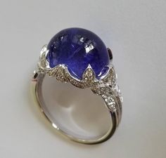 Dalben Tanzanite Diamond Gold Ring | From a unique collection of vintage cocktail rings at https://www.1stdibs.com/jewelry/rings/cocktail-rings/ Exquisite Formal Gemstone Cabochons, Luxury Diamond Cabochons For Wedding, Formal Hallmarked Diamond Cabochons, Elegant White Gold Cabochons For Formal Occasions, Luxury White Gold Diamond Cabochons, Formal Round Gemstone Cabochons, Formal Oval Cabochon Sapphire Ring, Formal Fine Jewelry Ring With Cabochon, Formal Fine Jewelry Gemstone Cabochons