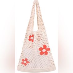 a white bag with red flowers on it