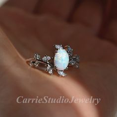 Vintage sterling silver white Opal ring, beautiful promise ring, unique birthday or anniversary gift. Materail: 925 Sterling Silver Main Stone: 6*8 mm Lab Opal Cut: Oval Side stone: CZ CS0466 ✈Free Shipping; 🎁Packaed with beautiful ring box; ★ 30 days return plicy; 🌺Custom service: 👉Stones can be different color, please contact for a custom request; 👉Can also customize with solid gold; 👉Engraving available; Home page:  https://www.etsy.com/shop/CarrieStudio White Sterling Silver Promise Ring, Fine Jewelry White Promise Rings, White Sterling Silver Wedding Rings, Dainty White Diamond Ring With Halo Setting, Dainty White Sterling Silver Diamond Ring, Dainty Oval White Diamond Ring, Dainty White Oval Diamond Ring, Fine White Jewelry For Promise, White Flower Ring With Halo Setting For Anniversary