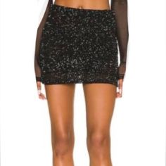 Brand New, Never Worn, Black Mini Sequin Skirt, Tag Says Size 10 But Fits Like Size 6, Has Stretch, Zip Back Closure, Extra Sequins. Maybe Missing Sequins(See Last 2 Photos Same Spot, Up Close/At Distance). Not Noticeable. Full Lined. Length 15” Waist 14.5” Stretches To 17” Hem 18” Fitted Sequin Mini Skirt, Party Mini Skort, Glamorous Black Mini Skirt For Party Season, Black Sequined Mini Skirt For Party Season, Black Mini Skirt For Summer Cocktail, Black Glamorous Mini Skirt For Evening, Glamorous Black Mini Skirt For Evening, Fitted Black Bottoms With Sequins, Glamorous Black Evening Mini Skirt