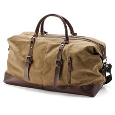 Discover your new travel companion in this vintage duffel bag – ideal for both short getaways and extended vacations. Boasts a spacious design with extra compartments for all your essentials – two front pockets for easy access and two inner pockets for the little knickknacks. Constructed from durable canvas and accented with luxurious leather. The strap is easily adjustable for a comfortable fit. Brown Satchel With Luggage Sleeve For Travel, Travel Satchel Bag, Brown Satchel Travel Bag, Travel Satchel Bag With Luggage Sleeve, Classic Large Capacity Satchel For Travel, Brown Travel Bag With Leather Handles, Brown Satchel Luggage For Travel, Travel Duffle Bag Satchel, Classic Large Capacity Duffle Bag For Trip