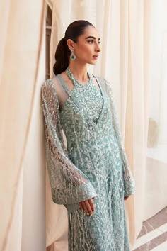 Classic Aqua Blue Embroidered Pakistani Wedding Dress Gown Shirt is a work of art featuring a chic embellished net that Evokes a sense of magnificence. Glamorous Dresses For Eid Reception, Glamorous Eid Reception Dress, Blue Floor-length Embroidered Dress For Wedding, Elegant Embroidered Organza Gown, Glamorous Organza Dresses For Eid, Luxury Floor-length Gown With Intricate Embroidery, Glamorous Gown For Eid, Elegant Resham Embroidered Dress For Reception, Elegant Embroidered Dress With Resham Embroidery For Reception