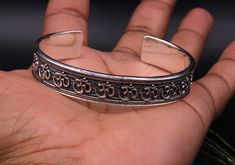 Vintage ethnic handmade solid silver bangle bracelet kada, antique hindi mantra " aum" design blessing jewelry from rajasthan india. Weight-37.020 grams. Width-13 mm. metal-sterling silver. metal purity-92.5% Type-bangle bracelet kada. Brand-Traditional-jewellery. length adjustable (open face bangle kada) Marking-925. condition- excellent, high polished , brand new. makes excellent gifting and collectible items. Handmade Silver Spiritual Cuff Bracelet, Adjustable Bangle Bracelet For Diwali, Handmade Spiritual Silver Cuff Bracelet, Handmade Silver Spiritual Bangle, Adjustable Bangle For Diwali, Adjustable Silver Bracelets For Diwali, Festival Oxidized Sterling Silver Cuff Bracelet, Sterling Silver Oxidized Cuff Bracelet For Festivals, Adjustable Round Bangle For Diwali