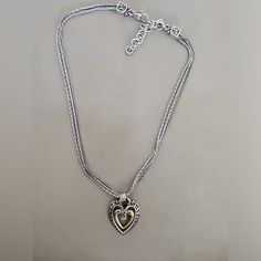 Vintage 925 Pandora Necklace With Triple Chain And Center Gold Plated Swinging Heart. Elegant Silver Heart Necklace With Heart Beads, Elegant Sterling Silver Jewelry With Heart Beads, Elegant Silver Heart Beads Necklace, Elegant Silver Heart Necklace For Mother's Day, Classic Heart Pendant Jewelry With Sterling Silver Clasp, Silver Double Heart Necklace With Heart Beads, Elegant Silver Heart Pendant Necklace, Elegant Heart Necklace With Silver Chain For Valentine's Day, Classic Silver Open Heart Jewelry