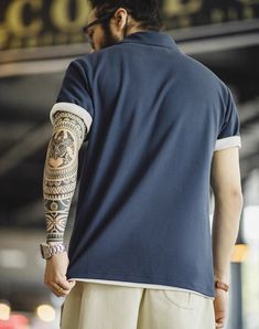 Step up your style game this summer with our American Workwear Retro Embroidered Polo! This isn’t just another men's t-shirt; it's your new go-to for both comfort and style. Crafted in a rich navy blue, it perfectly balances classic and casual. We've knitted this piece to keep you cool with a breathable blend of 61.4% cotton and 38.6% polyester fiber, ensuring both comfort and durability. Whether you’re hitting the town or heading to a barbecue, the lightweight fabric works hard to keep you fresh and at ease all day long. Forget about standard fits that cling or hang loose. Our polo comes in a range of sizes—from S to 2XL—with a standard fit that sits just right. Not too tight, not too loose. Just the confident look you need for every day. The short sleeves and lapel collar add a neat, pol Sporty Polo Collar T-shirt For Summer, Navy Cotton Polo Shirt With Short Sleeves, Navy Short Sleeve Cotton Polo Shirt, Navy Cotton Short Sleeve Polo Shirt, Summer Polo Collar T-shirt For Streetwear, Summer Polo Collar Top For Streetwear, Summer Polo Shirt For Streetwear, Summer Streetwear Polo Collar Top, Sporty Cotton Polo Shirt For Summer