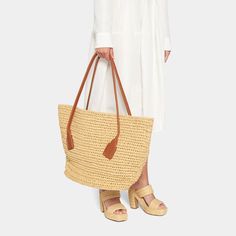 Bottega Veneta "Arco" shoulder bag in crochet raffia and calf leather  Flat shoulder straps  Open top  Interior, leashed zip pouch bag  Approx. 14.8"H x 23.2"W x 13"D Made in Italy Beige Crochet Bag With Intrecciato Weave For Shopping, Intrecciato Weave Crochet Shoulder Bag For Travel, Elegant Crochet Bag With Intrecciato Weave In Natural Color, Chic Crochet Bag With Intrecciato Weave For Shopping, Natural Crochet Bag With Intrecciato Weave For Shopping, Natural Crochet Bag With Intrecciato Weave For Travel, Beach Straw Bag With Intrecciato Weave In Natural Color, Beige Intrecciato Weave Crochet Beach Bag, Beige Intrecciato Weave Straw Bag