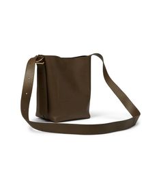 Give an edgy update to your bag collection by adding the Madewell® The Essential Mini Bucket Tote in Leather. The mini bucket tote is crafted from luxe leather and features a magnetic closure. The bag comes with an adjustable shoulder strap to carry it with ease..Interior pocket..Perfectly sized to hold all your essentials..Imported..Measurements: Bottom Width: 8 5/8 in Height: 8 1/2 in Madewell Bags, Bucket Tote, Perfect Purse, Mini Bucket, Bag Collection, Instagram Worthy, Tote Bag Leather, Bags Tote, Days Out