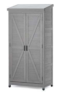 an outdoor storage cabinet with sliding doors on the front and side, in grey wood