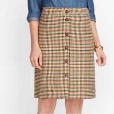 Nwt Houndstooth Plaid Button Front Skirt Size 12p Houndstooth (Red, Green, Navy, Tan & Brown) Silhouette: A-Line Hits: Top Of Knee Closure: Button Front (Top 3 Buttons Functional. Bottom 3 Buttons For Style Only) Lined Wool Blend Measurements Laying Flat: Waist 16.5” Length 20” Brown Skirt With Button Closure, Retro Plaid Lined Skirt Bottoms, Vintage Houndstooth Skirt, Brown Knee-length Skirt With Button Closure, Retro Plaid Knee-length Skirt, Houndstooth Pencil Skirt, Cotton Pencil Skirt, Plaid Wool Skirt, Button Front Skirt