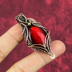 Handmade Red Gemstone As A Gift, Handmade Red Gemstone For Gift, Handmade Red Fusion Jewelry, Handmade Red Copper Jewelry, Handmade Fusion Red Jewelry, Hand Wrapped Carnelian Pendant Jewelry, Artisan Wire Wrapped Red Jewelry, Artisan Red Wire Wrapped Jewelry, Red Natural Stones Nature-inspired Jewelry