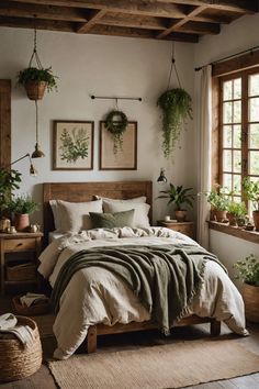 a bed sitting in a bedroom next to a window with potted plants on it