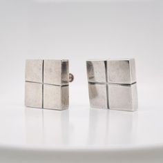 A very fine, three-piece Mexican silver modernist square cube clip-on earrings  and brooch.  By William Spratling.   With cube-shaped screw back earrings with screwbacks and a conformning cube-shaped brooch.     Simply a terrific parure from on of Mexico's jewerly masters!  Date: 20th Century  Overall Condition: It is in overall good, as-pictured, used estate condition. The three pieces have a wonderful, lived surface with some very fine & light surface scratches and other signs of expected ligh Elegant Rectangular Clip-on Earrings For Formal Events, Square Jewelry With Polished Finish For Formal Occasions, Classic Square Metal Jewelry, Modern Handmade Rectangular Jewelry, Modern Rectangular Jewelry For Formal Occasions, Modern Rectangular Wedding Earrings, Polished Metal Clip-on Earrings As Gift, Polished Metal Clip-on Earrings For Gift, Metal Clip-on Earrings With Polished Finish For Gift