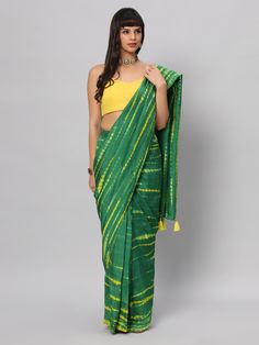 This light weight Green Tie dye saree is a versatile saree that is a must have in your wardrobe. This saree is extremely light weight will give you great pitures and can be worn for different ocassions. Team this saree up with Yellow raw silk blouse & statement earrings. Suitable for Poojas, Day function, brunhes, Wedding & haldi functions. Product Features: Saree Color: Green & yellow Blouse Color: Yellow Saree Fabric: Georgette silk Blouse Fabric: Raw Silk Saree Work: Tie Dye Print Wash Care: Green Chanderi Pre-draped Saree For Festivals, Green Chanderi Pre-draped Saree For Puja, Green Handloom Chanderi Pre-draped Saree, Green Slub Silk Pre-draped Saree For Diwali, Green Tussar Silk Pre-draped Saree With Dupatta, Traditional Green Slub Silk Pre-draped Saree, Festive Green Designer Saree, Green Raw Silk Blouse Piece With Cutdana, Green Semi-stitched Tussar Silk Blouse Piece