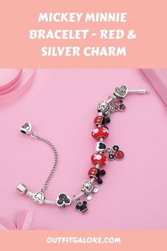 Our Red and Silver Charm Bracelet with a Mickey and Minnie Pendant Bead is the perfect addition for those who adore Disney or want to add a touch of fun to their jewelry collection. This classic design is sure to capture hearts with its charming pendant that showcases the beloved characters, Mickey and Minnie. Don this stunning piece on your wrist and let it bring joy to your day while also adding some whimsy to any outfit. Get ready for compliments galore with this must-have accessory! Adjustable Silver Themed Beaded Bracelets, Disney Style Silver Jewelry For Valentine's Day, Personalized Disney Silver Jewelry, Disney Silver Jewelry For Valentine's Day, Disney Silver Bracelet For A Gift, Silver Disney Bracelet As Gift, Silver Disney Jewelry For Valentine's Day, Disney Silver Bracelet Gift, Disney Sterling Silver Jewelry In Silver