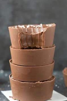 a stack of chocolate cups sitting on top of each other