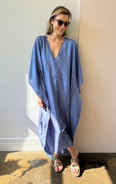 Our v neck sari caftan in a gorgeous blue handwoven silk A chic, easy oversized style Model is size 2/4 and 5'9 As this is a handmade product we recommend dryclean for silk Color: Blue — Width 45" flat across Length 50" — Handwoven Silk — One size fits all - (fits up to size 16) Spring Silk V-neck Kaftan, Blue Silk V-neck Kaftan, Spring Linen V-neck Kaftan, Chic Silk V-neck Kaftan, Casual Linen V-neck Kaftan, Relaxed Fit V-neck Maxi Dress Unlined, Relaxed Fit V-neck Unlined Maxi Dress, Relaxed Fit Unlined Maxi Dress With V-neck, Relaxed Fit Unlined V-neck Maxi Dress