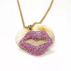 Pretty Pink Lips Necklace Metal: Alloy Chain Length: 64cm Pendant Size: 3.3cm X 4.5cm New Pink Alloy Necklaces For Valentine's Day, Pink Alloy Party Necklace, Pink Alloy Necklace For Party, Trendy Gold Rhinestone Necklace Gift, Long Rhinestone Metal Necklace For Gift, Long Rhinestone Necklace In Metal As Gift, Long Metal Rhinestone Necklace For Gift, Lips Necklace, Pretty Pink Lips