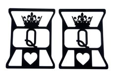 two black metal pieces with hearts and crowns on them