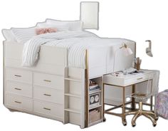 a white bed sitting next to a desk with a mirror on it's side