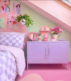 a bedroom with pink and green decor on the walls, bedding, and dresser