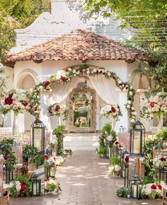 the instagram page on instagram shows an image of a gazebo decorated with flowers and greenery