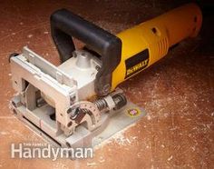 a sanding machine sitting on top of a wooden table next to a power tool