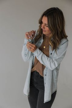 Introducing our Vintage-Inspired Heritage Denim Shirt Jacket for women. The perfect addition to your wardrobe for any season, AND to match with your littles. With its snap closures and scoop hem bottom, this jacket brings a touch of classic style to any outfit. Crafted from high-quality and light weight denim material, this shirt jacket boasts a timeless look that's both durable and comfortable to wear. The vintage-inspired wash gives it a unique character that sets it apart from your standard s Hanna Marin Rosewood Jacket Denim, Light Blue Denim Shirt Women Outfit Ideas, Outfits With A Denim Jacket, Black Denim Shacket Outfit, Womens Denim Shirt Outfit, Denim Shirt Outfit Women Fall, Outfits To Wear To A Theater Play, Black Denim Top Outfit, Womens Vintage Fashion