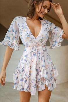 Floral printed ruffled flutter half sleeved V neck mini dress with elastic and self-tie waist. Flowy fabric, perfect for a special occasion like wedding guest, anniversary, or date night! Recommended sizing XS - 0-2, S - 4, M - 6, L - 8-10. Model is 5'9 and is wearing a size S. Long Sleeve Dress Floral, Pink Floral Print Dress, Strappy Stilettos, Pink Floral Print, Surplice Neckline, Long Sleeve Short Dress, Floral Short, Hem Dress, Printed Mini Dress