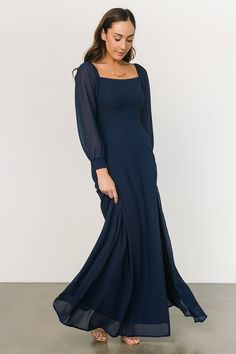 Our Giselle Maxi Dress comes in a black color and is oh so gorgeous. Don't forget to get this dress for your next event! Elegant Dress With Smocked Back And Bishop Sleeves, Elegant Maxi Dress With Smocked Back For Date Night, Elegant Maxi Dress For Date Night With Smocked Back, Formal Chiffon Dress With Square Neck, Formal Square Neck Chiffon Dress, Elegant Evening Dresses With Smocked Cuffs, Elegant Dresses With Bishop Sleeves And Smocked Cuffs, Fitted Chiffon Maxi Dress With Smocked Back, Elegant Fitted Maxi Dress With Smocked Bodice